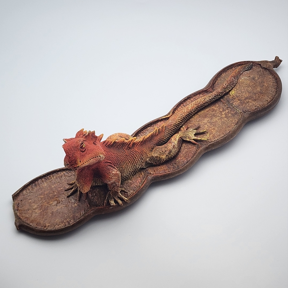 Handcrafted Sculpture Lizard Lounging on a Seed Pod.